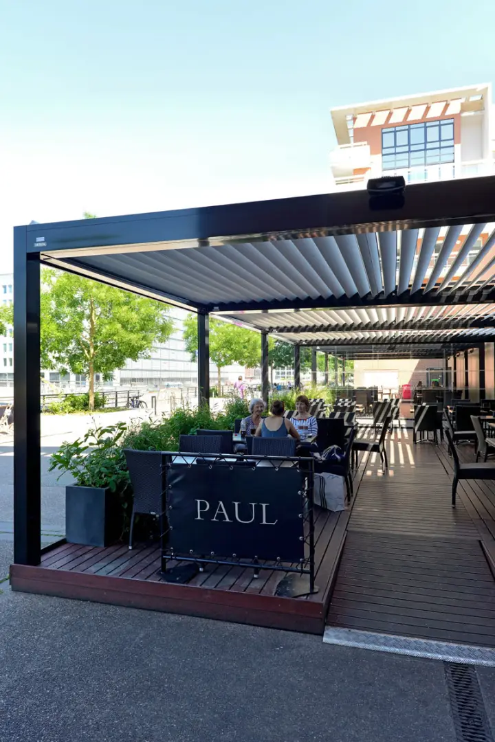 2000 Series Outdoor Shelter covering an outdoor dining area at PAUL