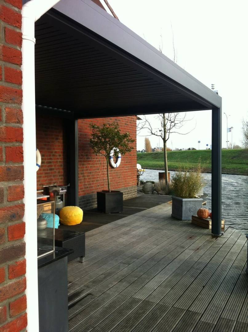 1500 Series Outdoor Shelter above a deck behind a home