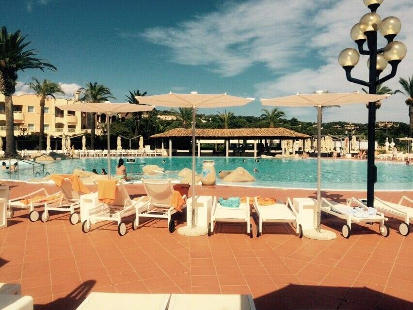 Réve Umbrella next to the pool at a resort