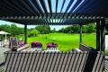 2000 Series Outdoor Shelter over an outdoor seating area looking out at a golf course