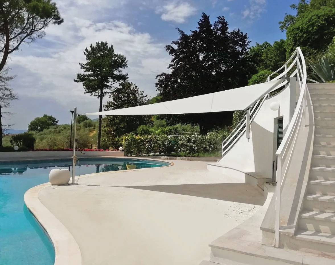 Velart Sail Shade next to a pool