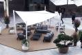 Outdoor seating area protected by the Velora Sail Shade