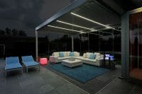 2000 Series Outdoor Shelter above a patio with lights at dusk