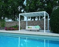 a white Retractable Roof Poolside Cabana with closed roof next to a pool