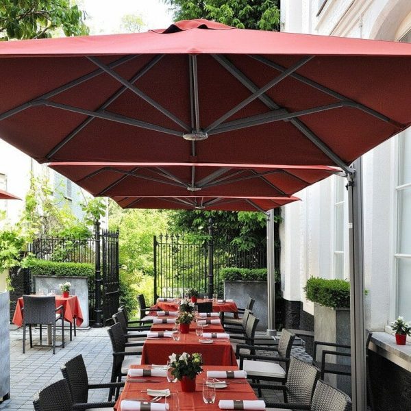 p6 square duo umbrella covering an outdoor dining area
