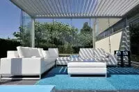 2000 Series Outdoor Shelter covering a seating area next to a pool