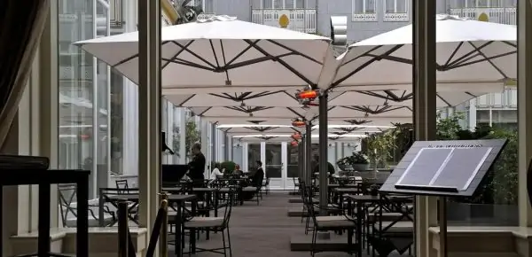 cantilevered commercial umbrellas over outdoor restaurant seating