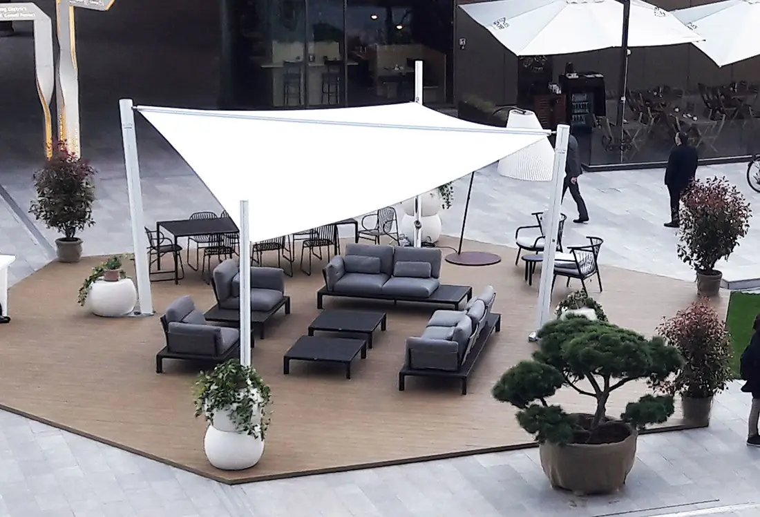 Outdoor seating area protected by the Velora Sail Shade