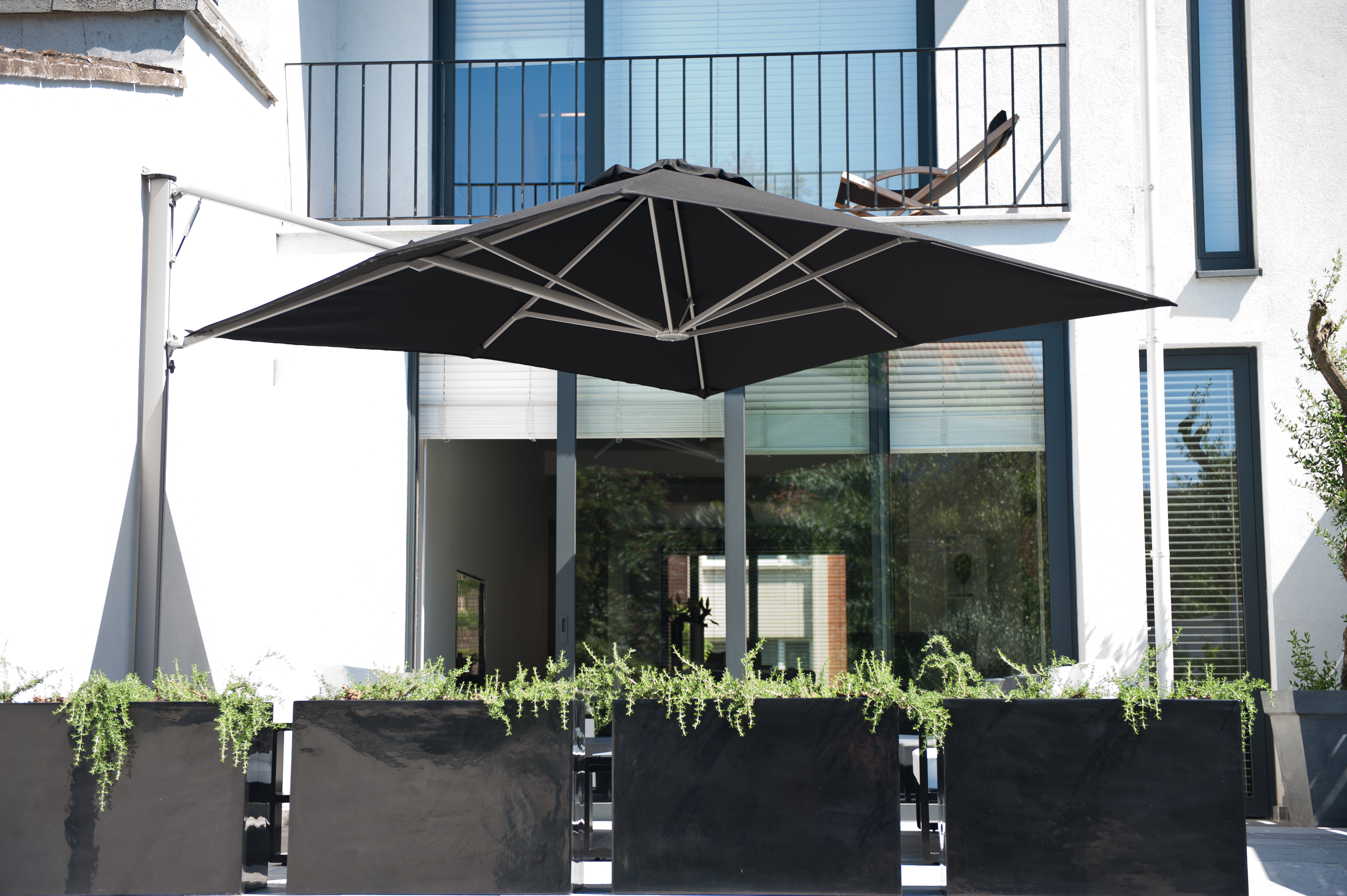 p7 umbrella with black canopy next to a balcony